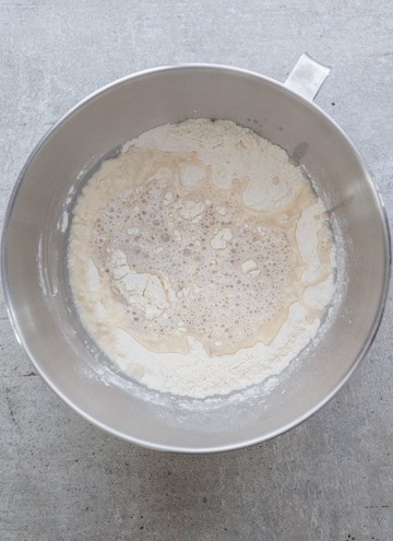 add the yeast mixture to the flour