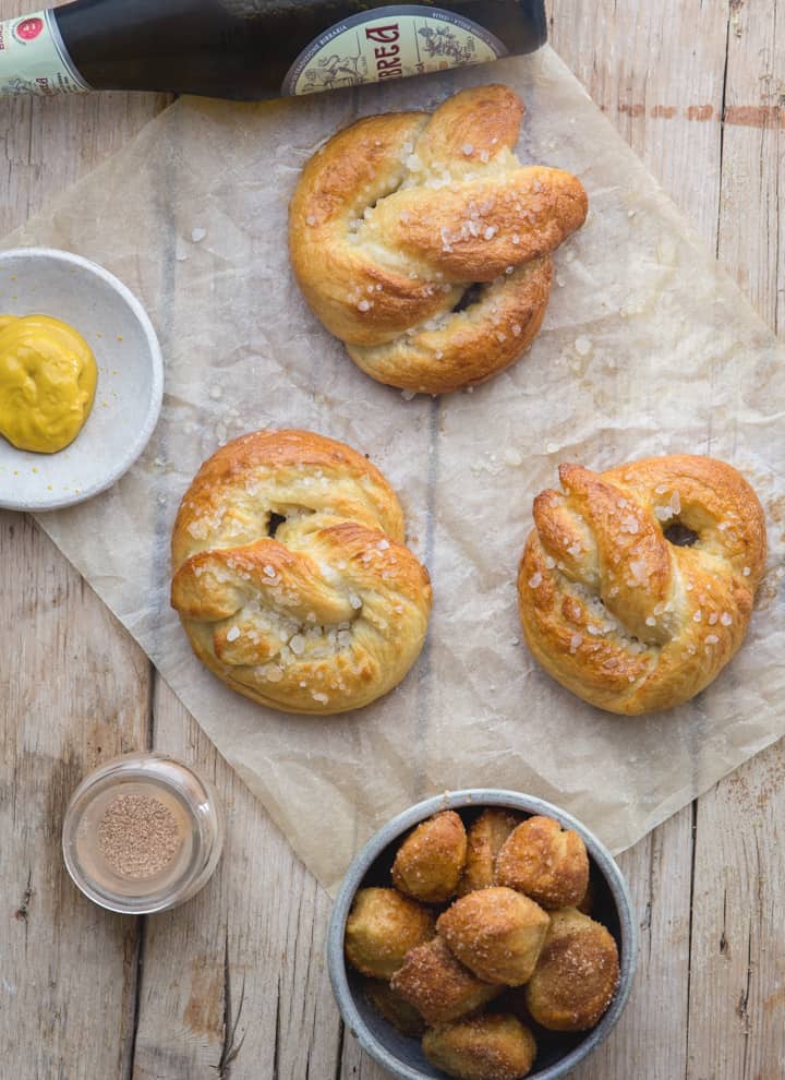 pretzels on a white paper with pretzel bites in a small bowl