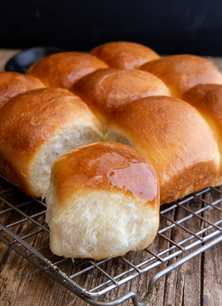 dinner rolls on a wire rack