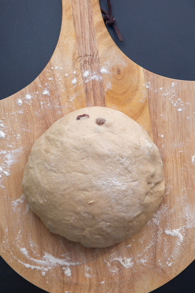 forming the dough into a ball on a flat board.
