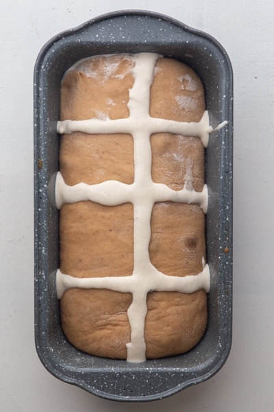 a cross on the dough before baking