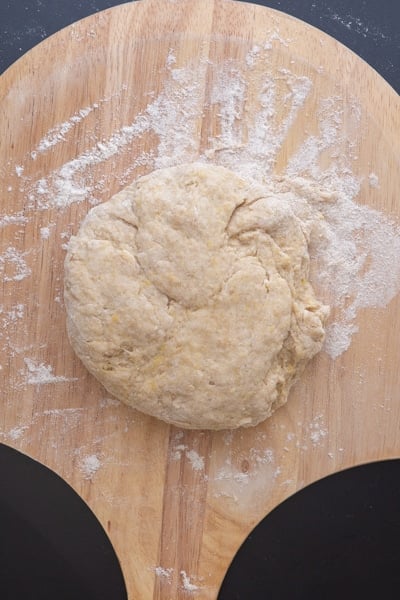 folding the dough until compact.