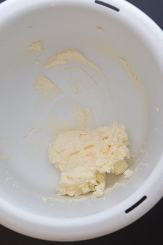 butter and cream cheese beaten in a white bowl.