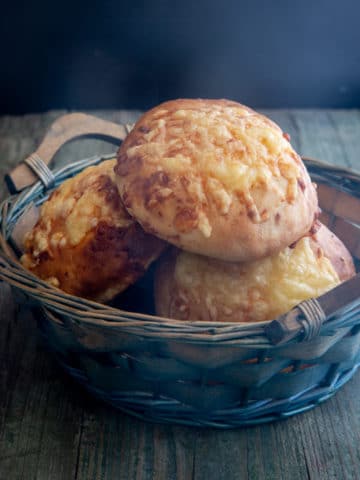 cheese buns in a blue basket.