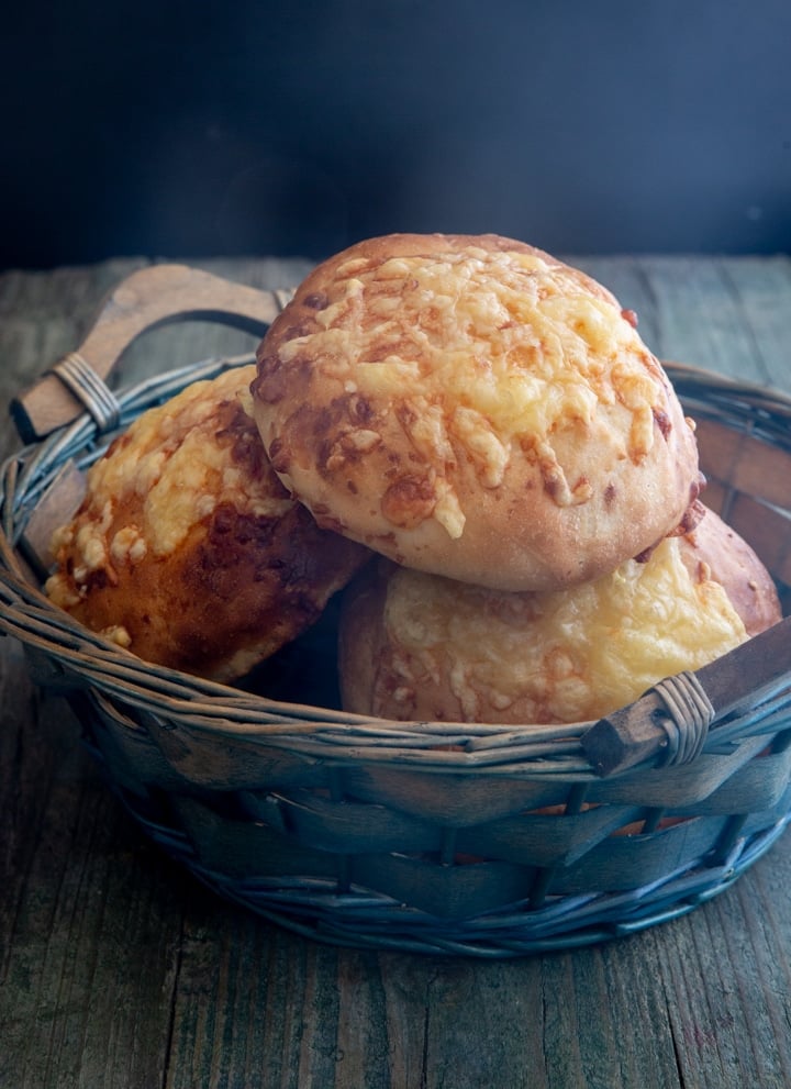 cheese buns in a blue basket.