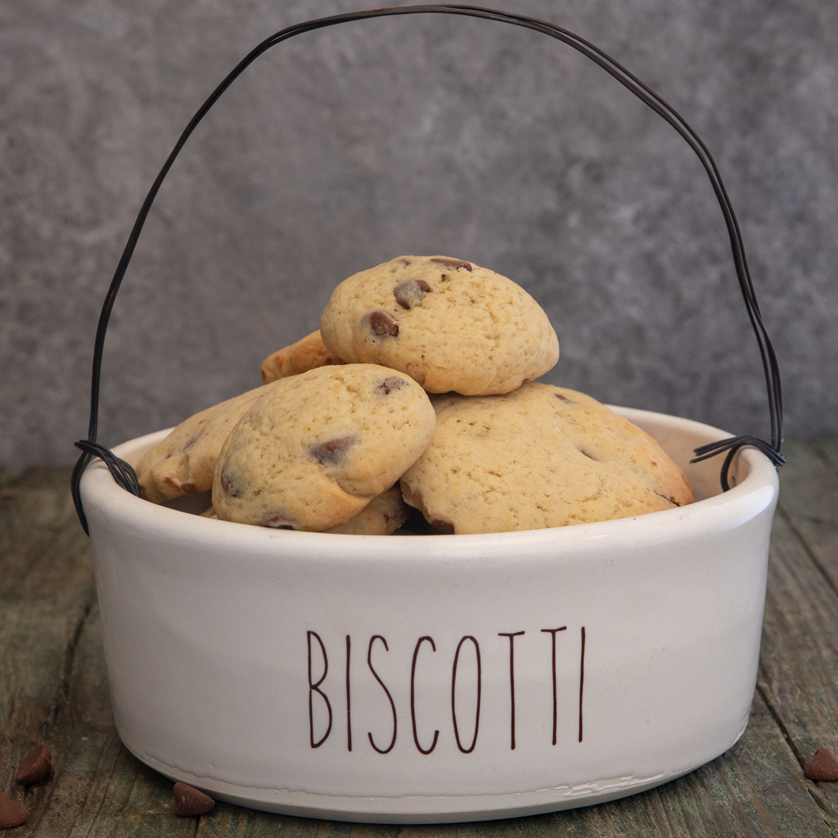 chocolate chip cookies in a white biscotti bowl.