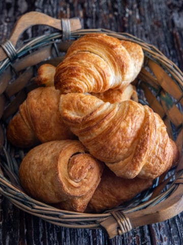 Croissant in a blue basket.