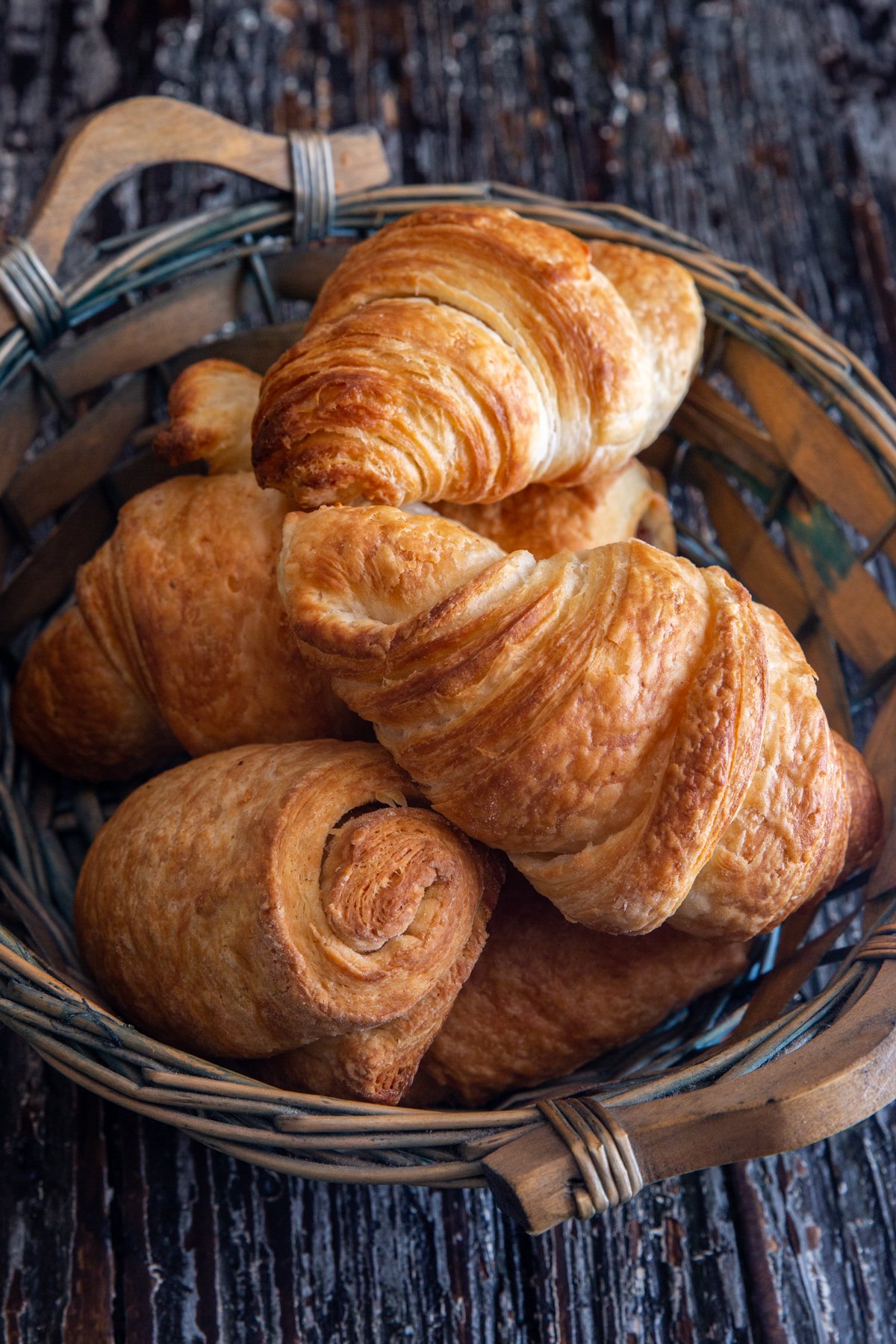 Croissant in a blue basket.