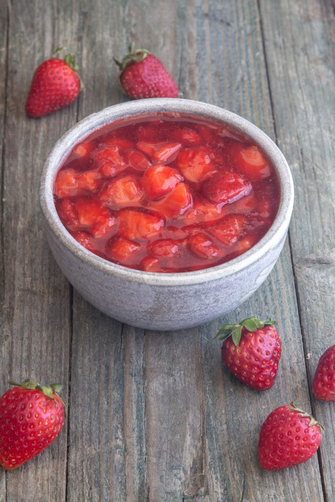 Strawberry sauce in a white bowl.