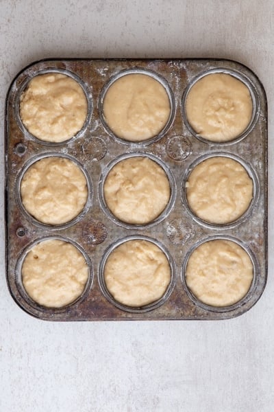 Donut muffins in the muffin tin before baking.