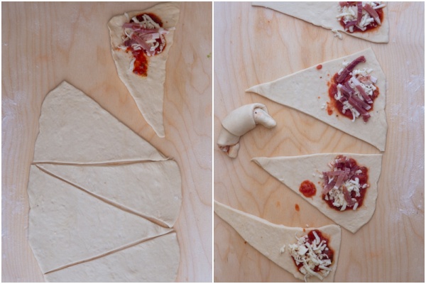 Cutting out the crescents on a board & topping with filling.