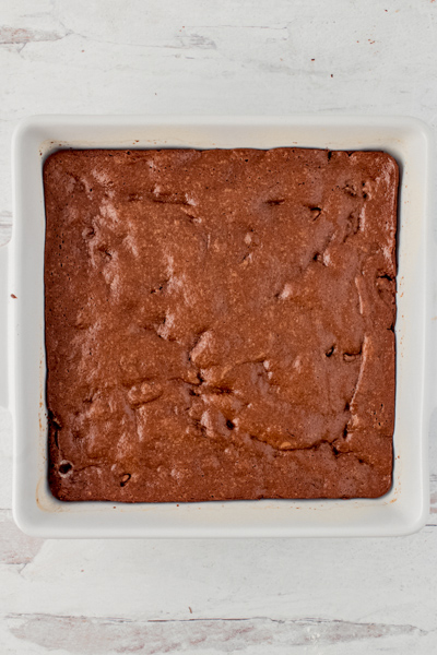 The baked brownies in the white pan.