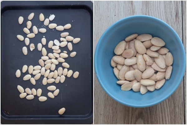Roasted almonds on a cookie sheet & in a clean bowl.