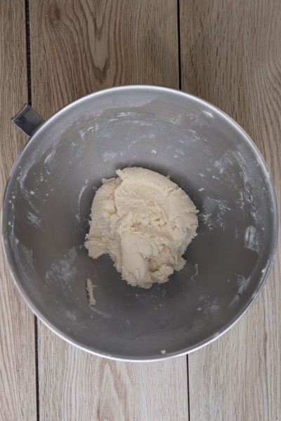 Batter beaten in a silver mixing bowl.