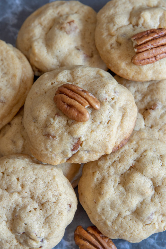 brown sugar pecan cookies close up with pecans scattered around