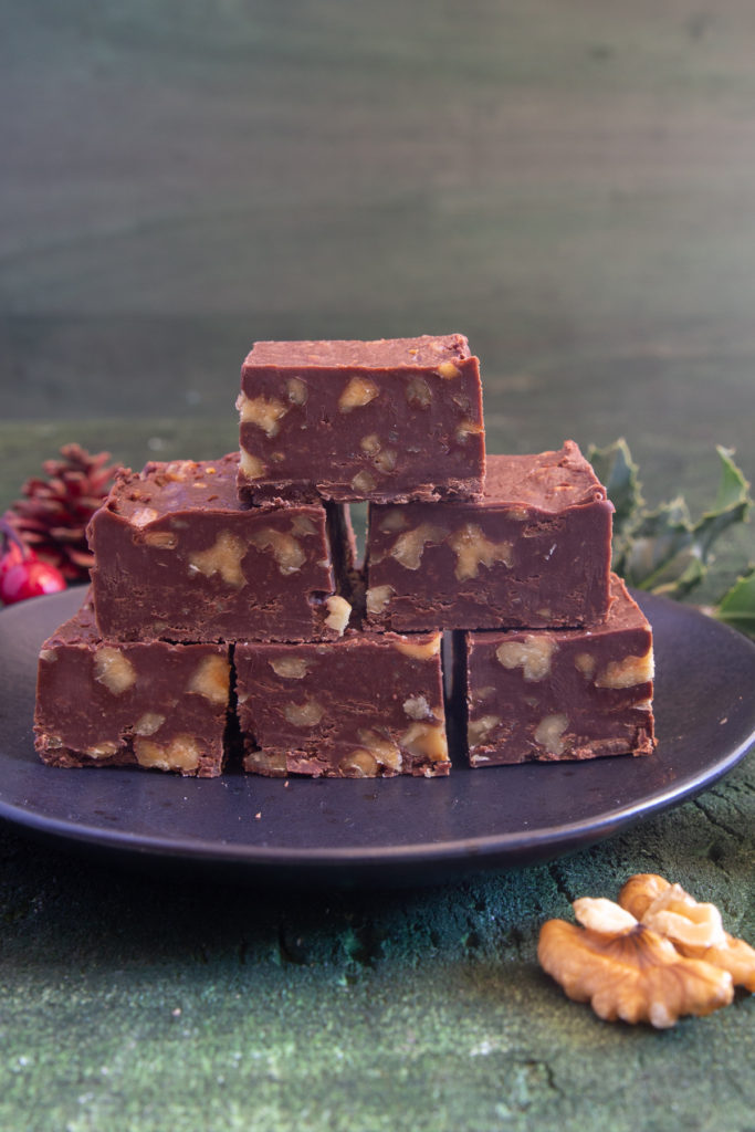 5 pieces of walnut fudge stacked.