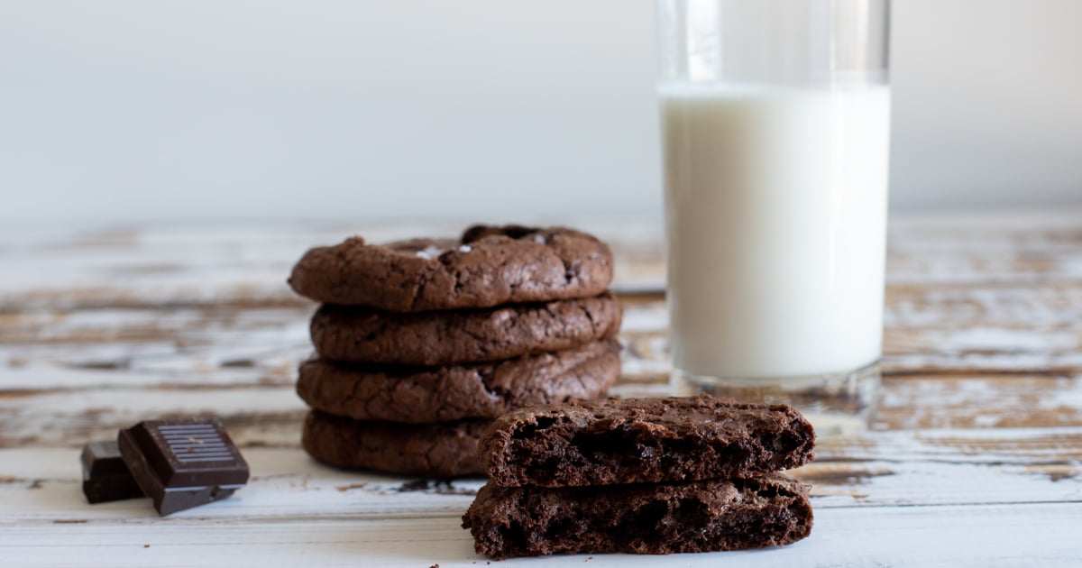 Fudgy brownie cookies with a glass of milk.