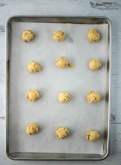 The cookie dough on a cookie sheet before baking.