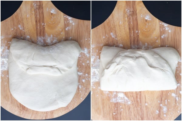 Folding the dough on a wooden board.