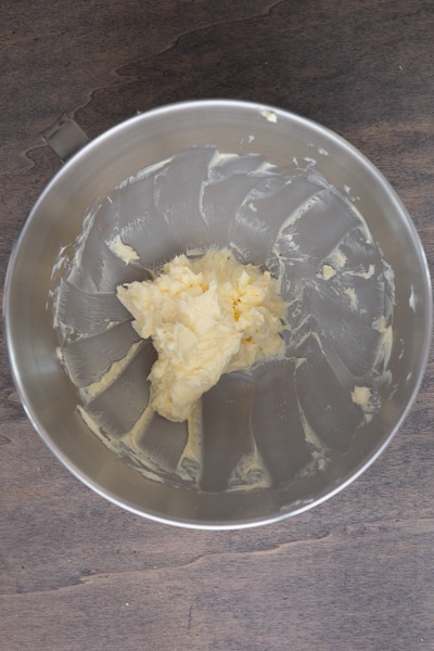 Butter in mixing bowl beaten until creamy.