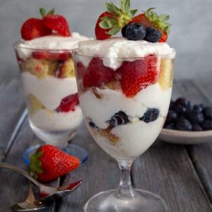 2 cheesecake parfait on a board.