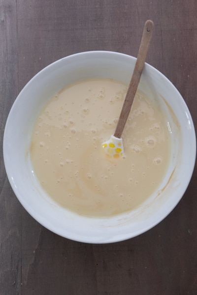 Condensed milk mixed in a bowl.