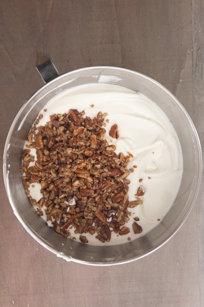 Pecan nuts mixed into the ice cream mixture.