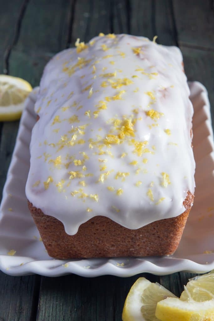 Lemon pound cake on a white plate.