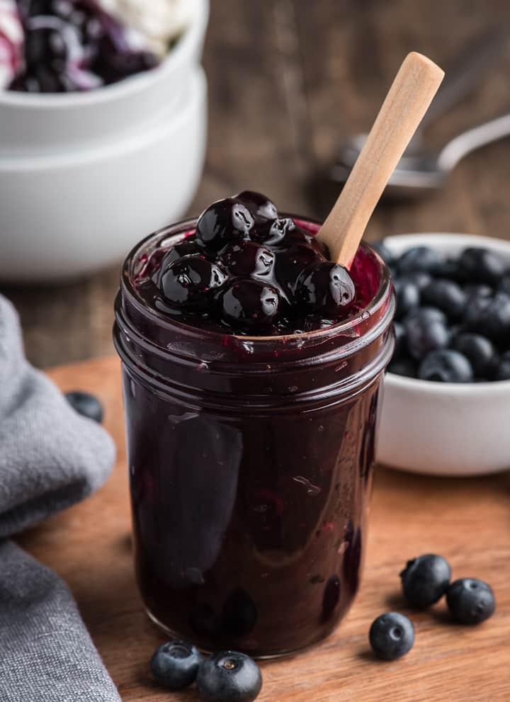 Blueberry sauce in a glass jar.