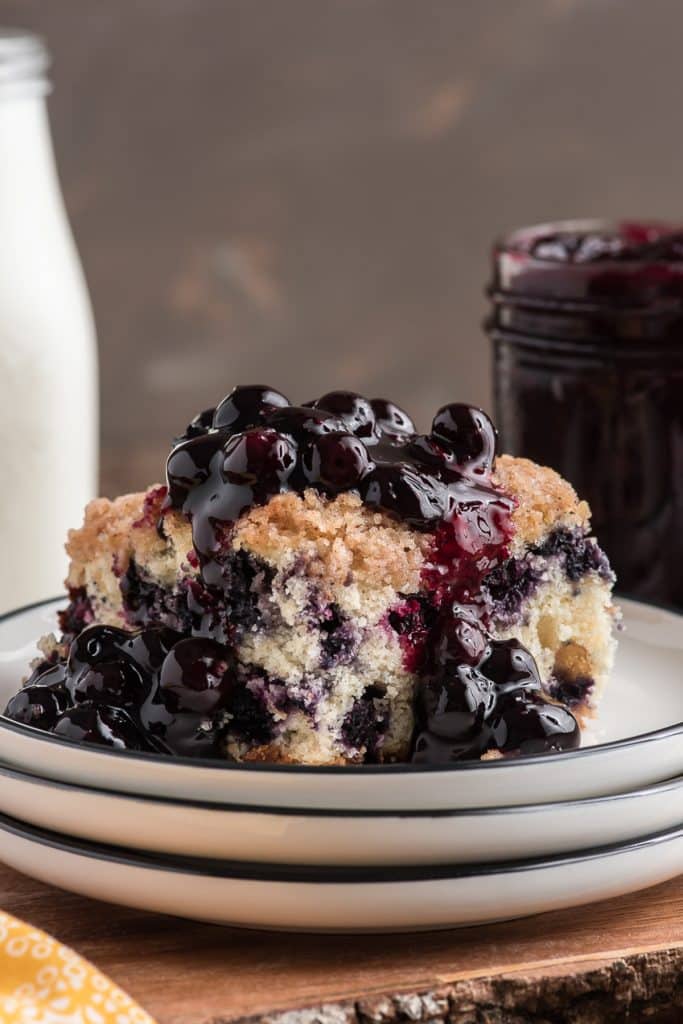 Blueberry cake on a white plate.