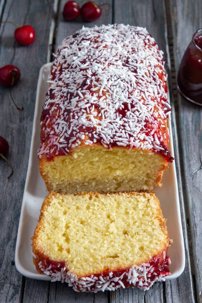 Coconut bread with a slice cut.