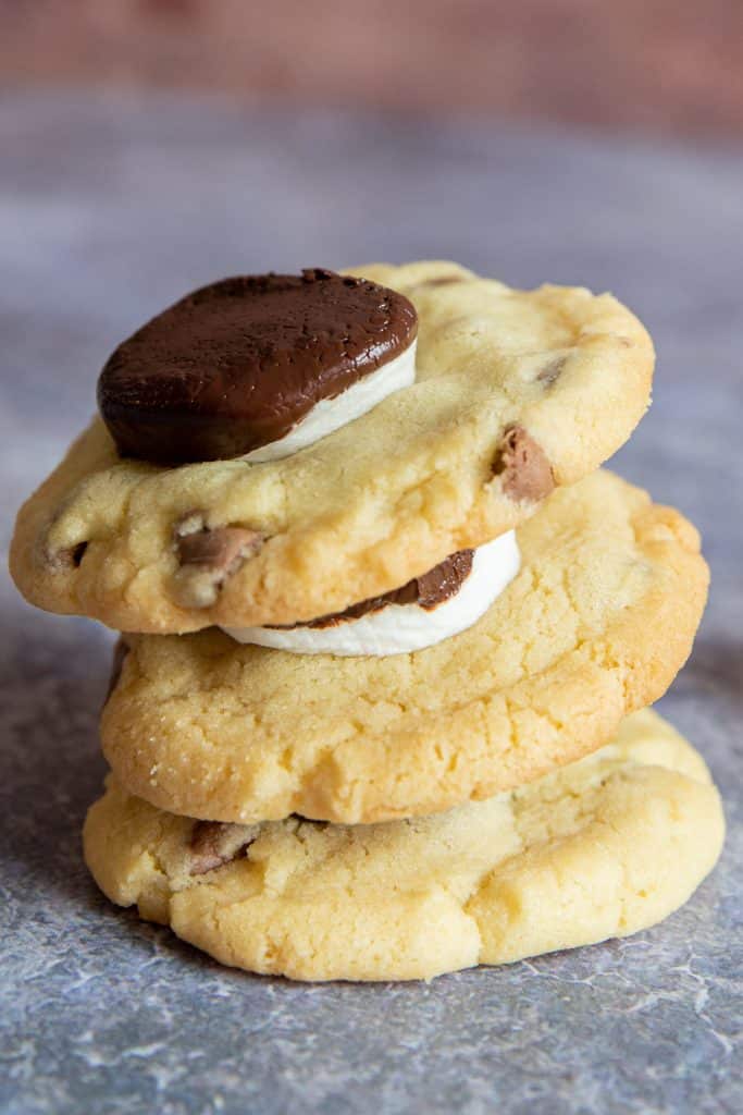 Three cookies on top of each other.