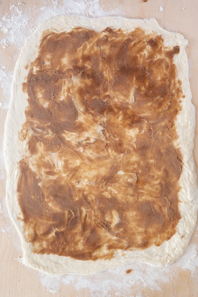 The cinnamon spread on the dough.