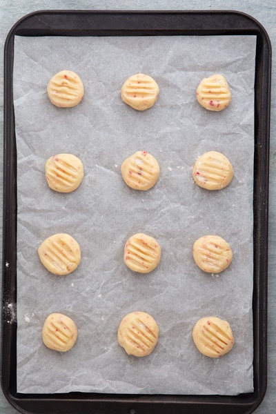 Cookies on a parchment paper lined cookie sheet.