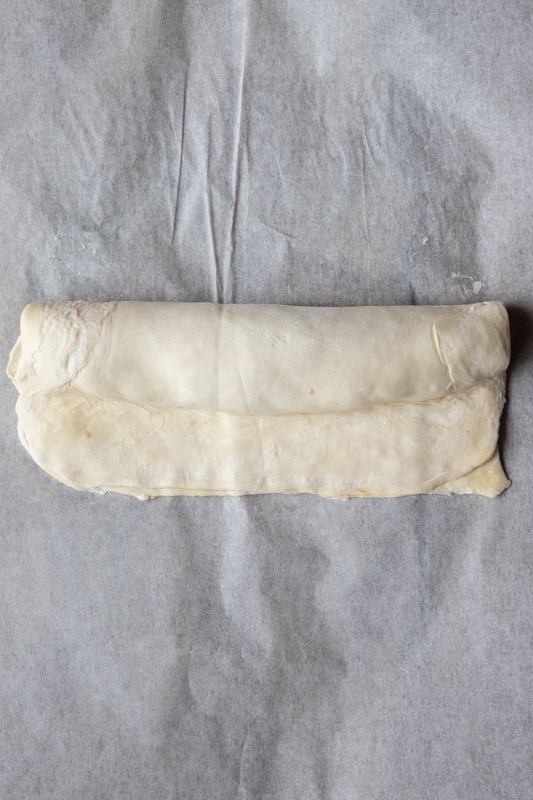Rolled puff pastry to make sausage rolls.
