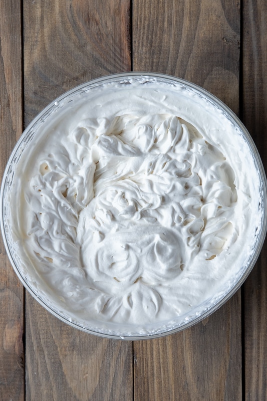 Whipping cream in a bowl.
