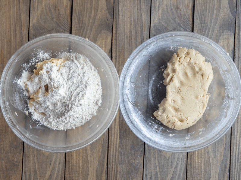Dry and wet ingredients mixed together to form a compact dough in a mixing bowl.