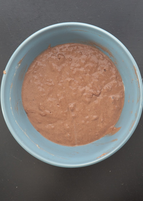 Dry and wet ingredients mixed together in a bowl.