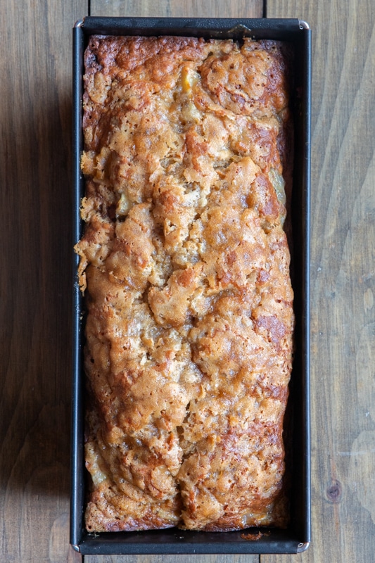 Baked banana bread in the loaf pan.