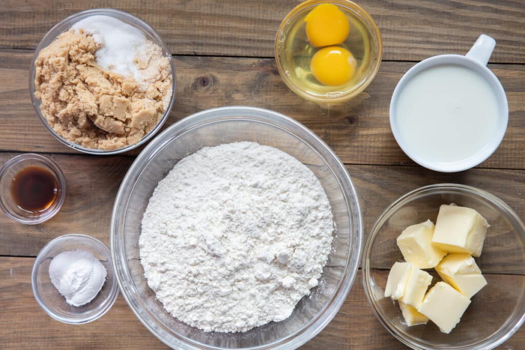 Ingredients to make a caramel bread in separate bowls.