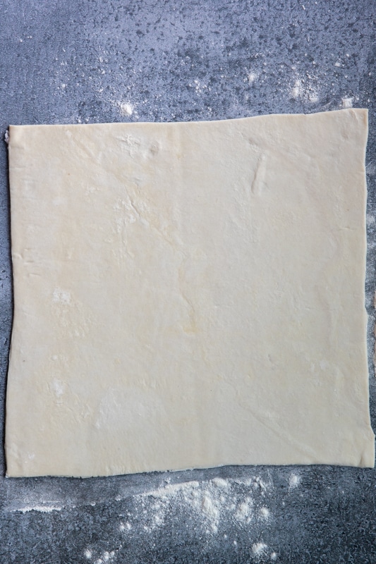 puff pastry rolled on a flat surface.