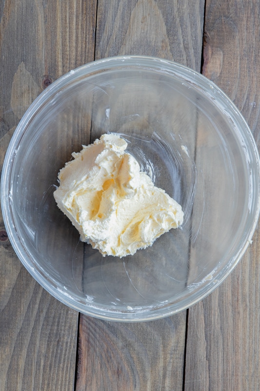 Butter mixture creamed in a glass bowl.