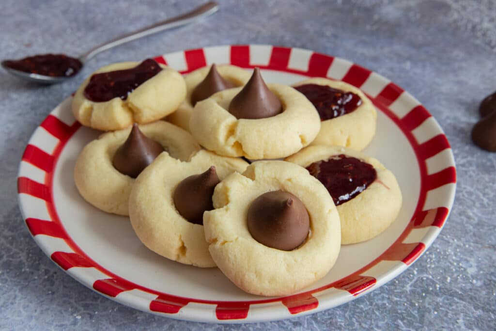 Thumbprint cookies on a white plate.