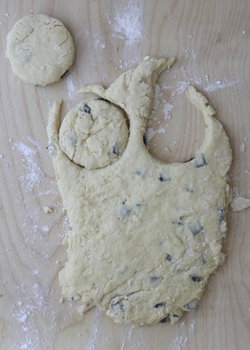 Dough flattened and cut in circles with a cookie cutter.
