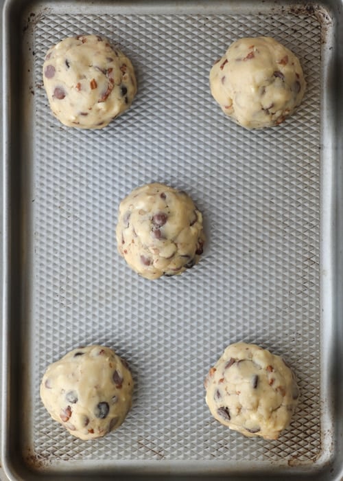 Formed cookies on a baking sheet.