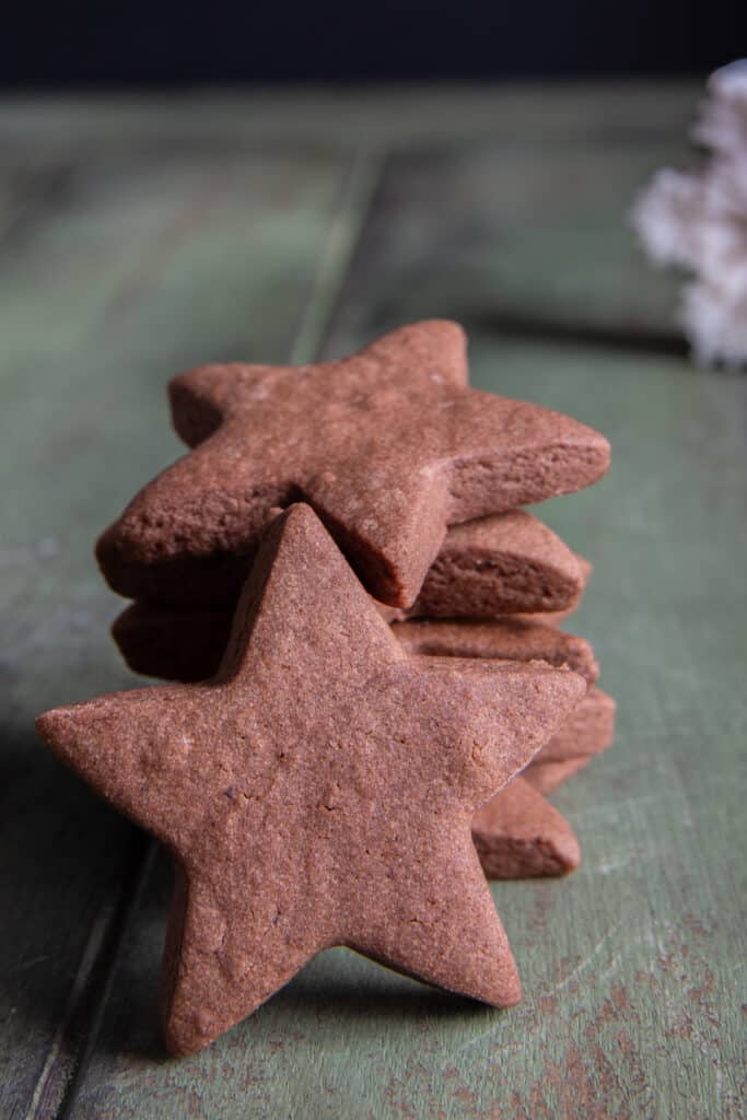 Four chocolate stars stacked with one leaning on them.