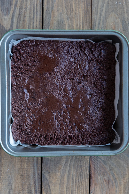Brownie mix in a square baking pan.