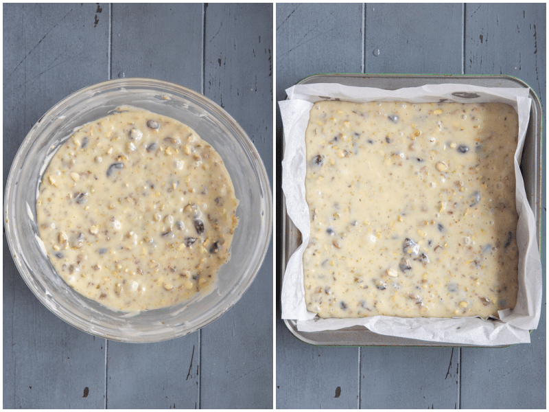 White chocolate mixed with cranberries and pistachios in a bowl and then transferred into a square pan.
