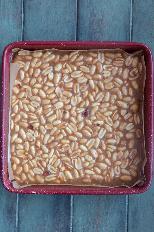 Peanut squares in a square baking pan.