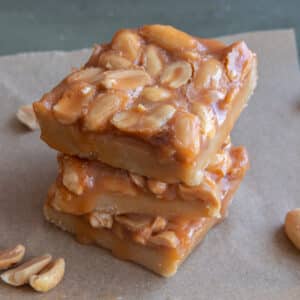 Three old fashioned peanut squares stacked.